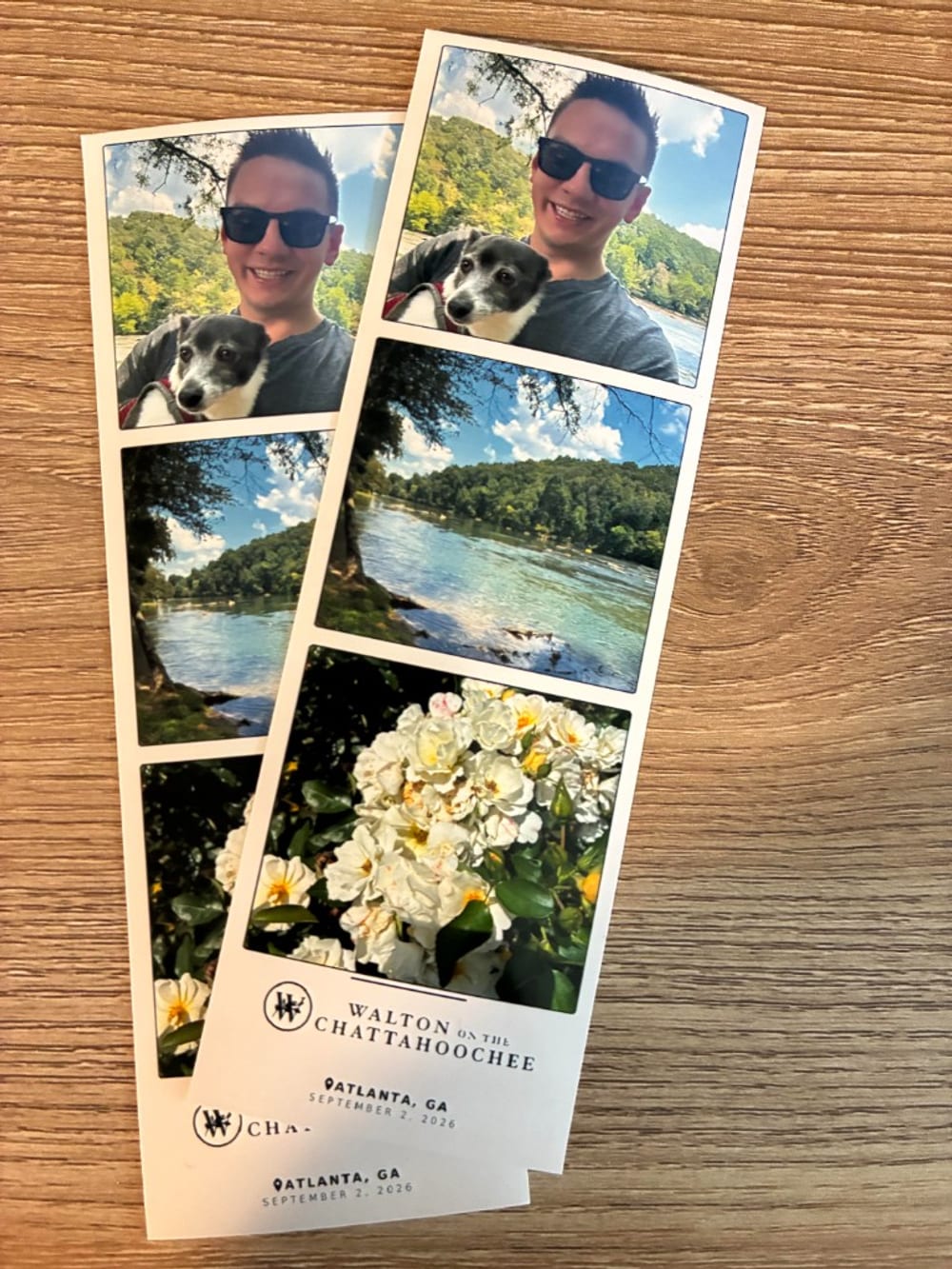 A pair of printed photo strips from a Photostrip kiosk showing a guest with their dog and scenic river photos, with custom venue branding reading Walton on the Chattahoochee, Atlanta GA.